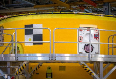 The forward skirt section of NASA’s Space Launch System is shown shortly after its final assembly at the Michoud Assembly Facility in New Orleans. This uppermost segment houses the rocket’s flight computers, avionics, and camera systems, forming the control center that guides the SLS during launch and ascent. Built for Artemis I (Exploration Mission-1), this structure would later be integrated into the core stage for its 2020 launch from Kennedy Space Center.