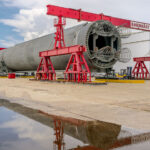 SLS Rocket Model at Michoud Assembly Facility 1 A model SLS rocket outside the NASA Michoud Assembly Facility. The model was used to test transporting on the NASA barge.