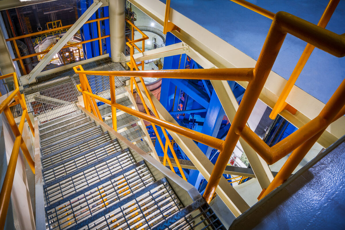 Stairwell Inside NASA’s Vertical Assembly Center 1 A stairwell winds through the interior of NASA’s Vertical Assembly Center at the Michoud Assembly Facility in New Orleans. The industrial structure, with its orange and blue framework, provides access to various levels of the 170-foot-tall welding system used to assemble core stages of the Space Launch System. The facility supports precision manufacturing for the Artemis program’s heavy-lift rockets.