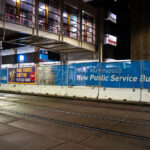Bail Bonds and City of Minneapolis Public Service Building banners on fencing around new development.