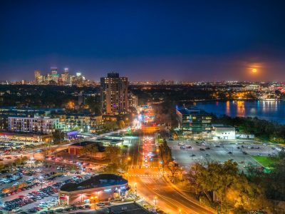 Minneapolis skyline and Bde Maka Ska under full moon
