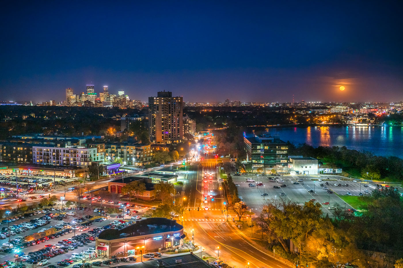 Minneapolis skyline and lakes during a full moon