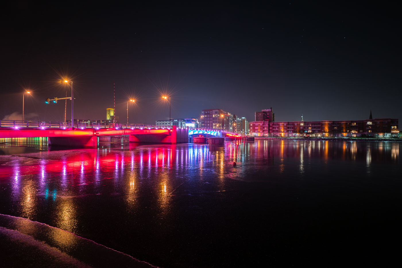 Lit up bridge over the fox river at night