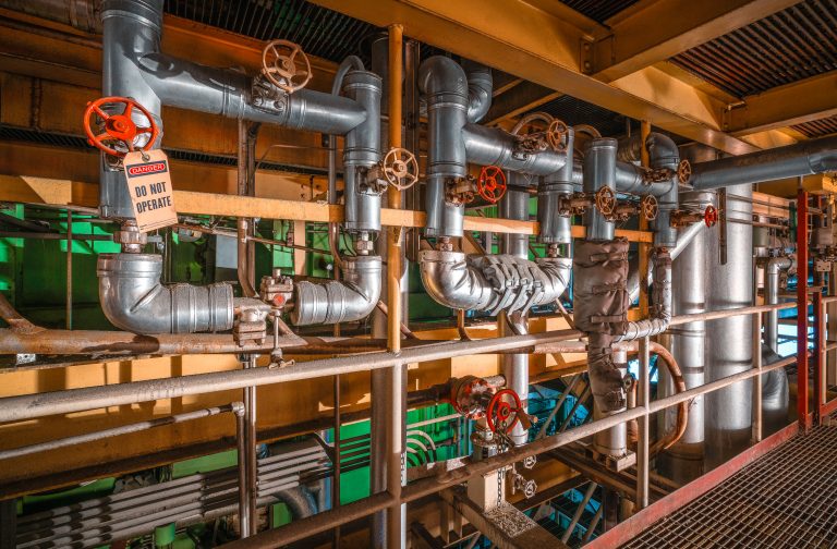 Steam Pipes and Valve Manifold, Menasha Power Plant 1 Insulated steam pipes and red valve wheels inside the Menasha power plant piping system.