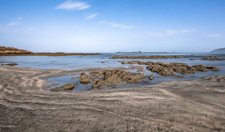 Rocky Shoreline and Tidal Pools, Gujarat 1 Rocky shoreline and tidal pools at low tide in Gujarat, India.