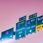 Exit signs on Interstate 35W for Hiawatha Ave, 11th Ave, Washington Ave. in Minneapolis, MN.