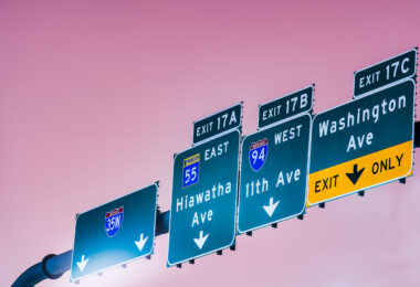 Exit signs on Interstate 35W for Hiawatha Ave, 11th Ave, Washington Ave. in Minneapolis, MN.