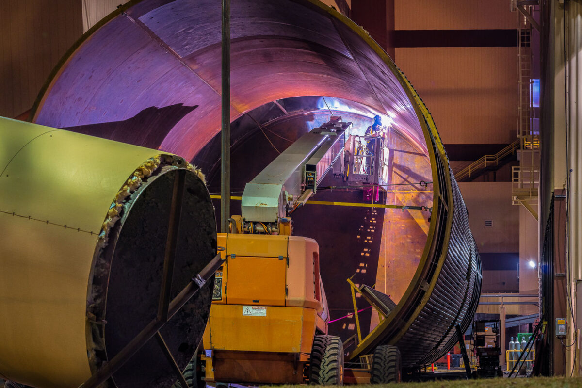 Man working on a water tank for the Hennepin Energy Recovery Center.