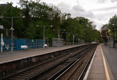 Blackheath railway station, located in southeast London, serves as a key stop on the Southeastern network connecting the capital to Kent. The twin platforms and simple iron canopies reflect mid-Victorian railway architecture, though much of the station has been modernized with LED lighting, CCTV, and accessible ramps. The gentle curve of the tracks and the subdued lighting of the evening evoke the quiet rhythm of the commuter hour, as trains shuttle between London Cannon Street, Charing Cross, and the suburbs beyond.