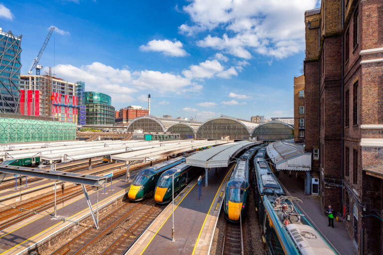 London Paddington Station in London 2 Modern high-speed trains wait beneath the soaring glass arches of Paddington Station in London, one of the capital’s busiest rail hubs. Designed in the mid-19th century by engineer Isambard Kingdom Brunel, the station blends historic architecture with the bustle of contemporary travel, serving as the terminus for Great Western Railway routes to Wales and the West Country. Around the concourse, new developments and construction highlight the area’s transformation, with Paddington’s mix of heritage and modernity on full display.