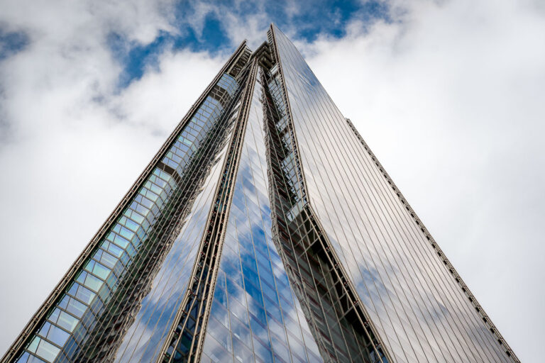 The Shard, London: Renzo Piano's Glass Skyscraper 2 The Shard, a 310-meter skyscraper designed by Renzo Piano, stands near London Bridge. Completed in 2012, its glass façade is engineered to mirror the sky, reflecting London's dynamic atmosphere. The building houses a variety of commercial and hospitality spaces, including offices, restaurants, and the Shangri-La Hotel, alongside a public observation deck. Its distinctive tapering form has become a prominent feature of the city's architecture along the River Thames.