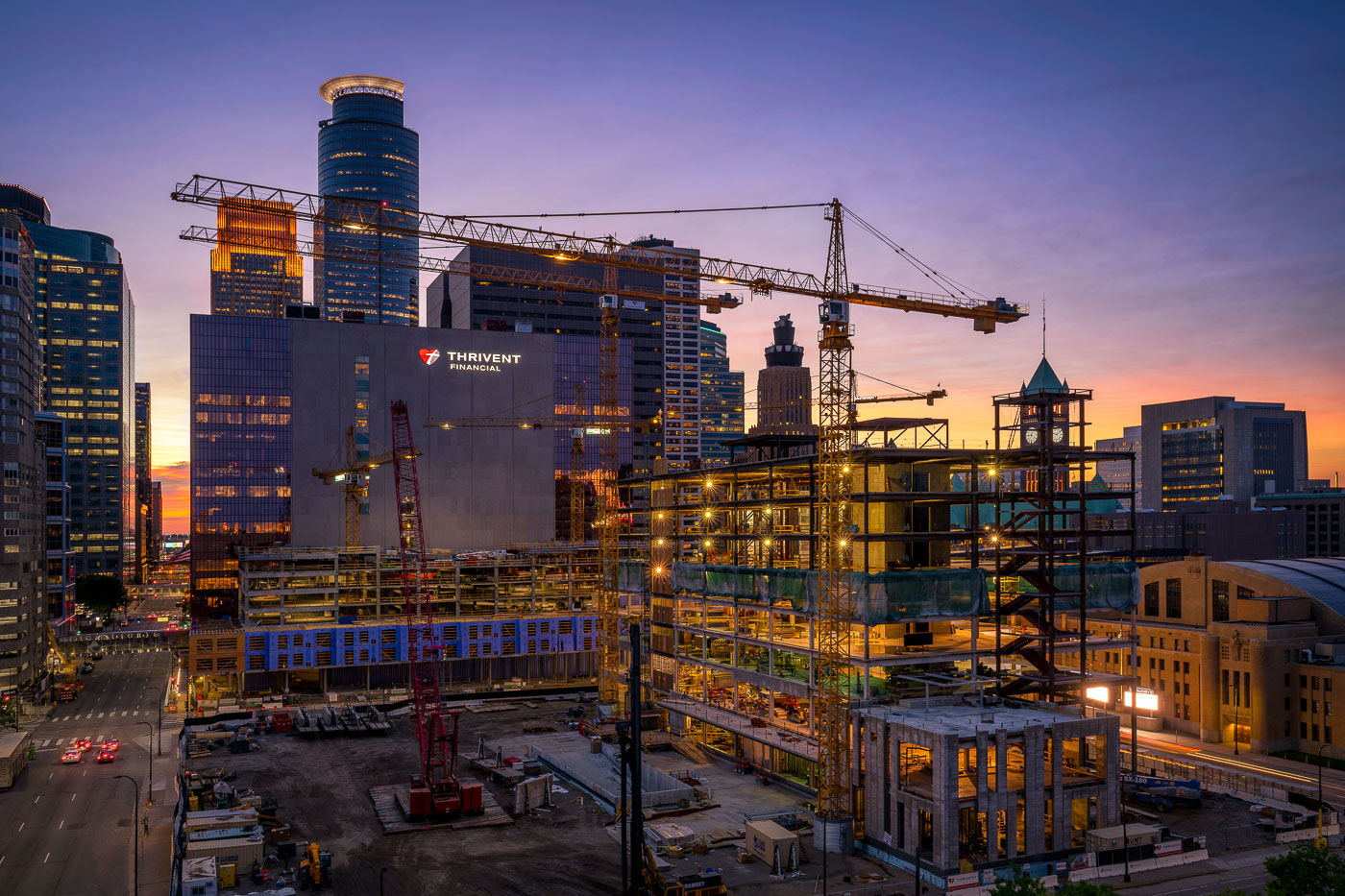 Development tower cranes in Minneapolis at sunset