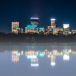 Foggy Bde Maka Ska and Minneapolis Skyline behind.