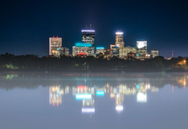 Foggy Bde Maka Ska and Minneapolis Skyline behind.