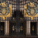 Royal Coat of Arms on the front gates of Buckingham Palace.