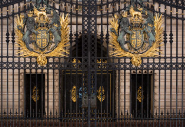 Royal Coat of Arms on the front gates of Buckingham Palace.