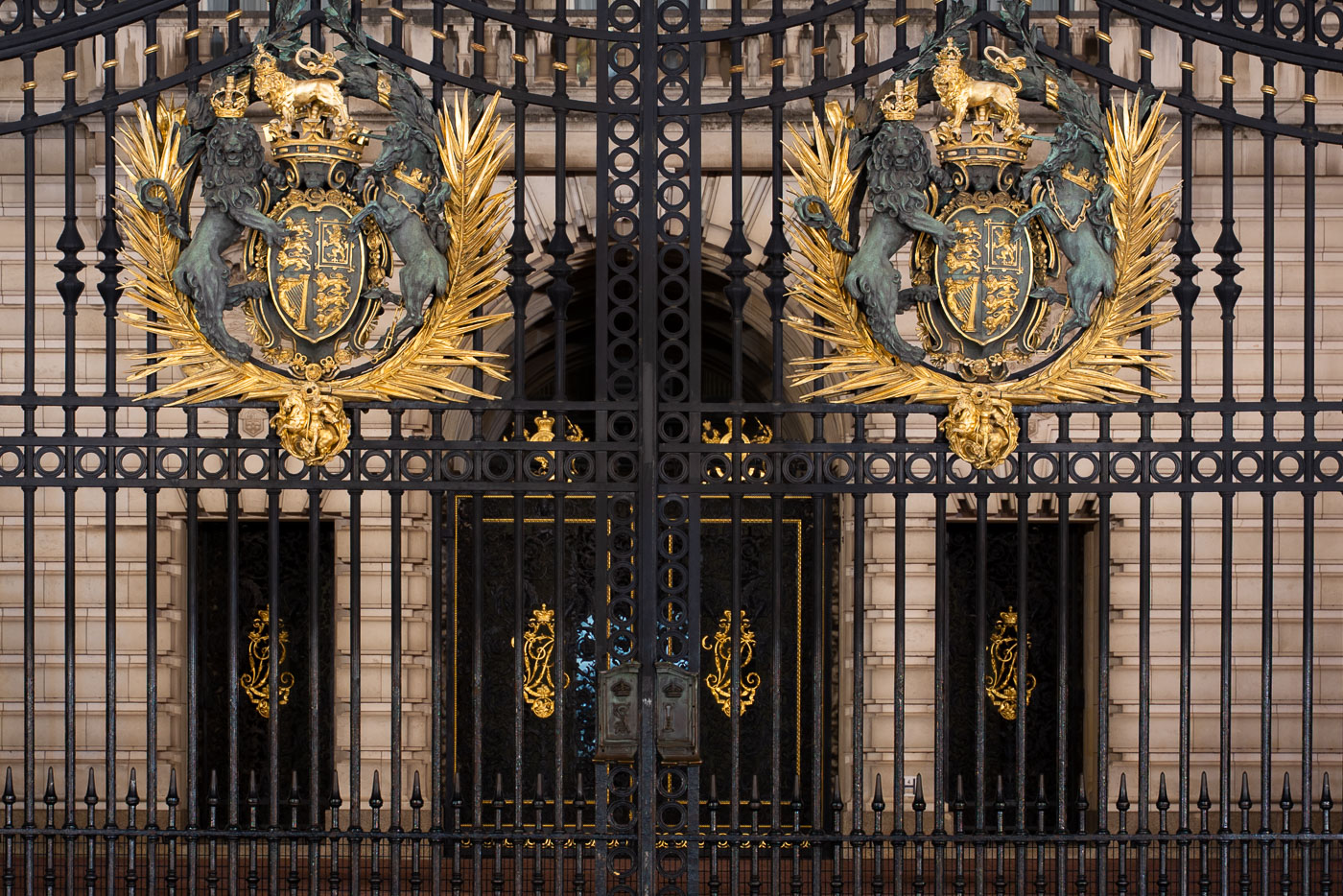 Royal Coat of Arms on the front gates of Buckingham Palace.