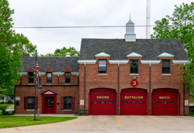 Green Bay Fire Station No. 3, located in Green Bay, Wisconsin, represents a classic mid-20th-century firehouse design with its red brick façade, steep rooflines, and distinctive arched bay doors. Serving the west side of the city, this station houses an engine company, battalion chief, and medic unit, providing rapid response coverage to nearby residential and commercial areas. The building’s architecture reflects an era when civic structures balanced functionality with traditional craftsmanship, embodying a sense of permanence and community trust.