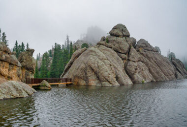 Sylvan Lake is a lake located in Custer State Park, in the Black Hills of South Dakota, United States. It was created in 1881 when Theodore Reder built a dam (the Sylvan Lake Water Dam) across Sunday Gulch Creek. The lake area offers picnic places, rock climbing, small rental boats, swimming, and hiking trails. It is also popular as a starting point for excursions to Black Elk Peak and The Needles.  -- Wikipedia