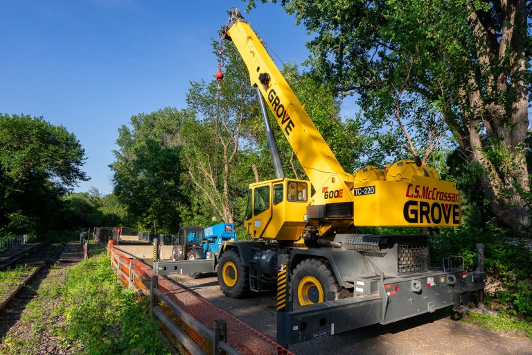 Grove Crane Staged on the Kenilworth Trail for Southwest LRT Work 1 Yellow Grove mobile crane on Kenilworth Trail in Minneapolis during Southwest LRT construction.