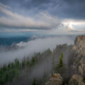 Black Elk Peak (formerly Harney Peak) is the highest natural point in South Dakota, United States. It lies in the Black Elk Wilderness area, in southern Pennington County, in the Black Hills National Forest. The peak lies 3.7 mi (6.0 km) west-southwest of Mount Rushmore. At 7,242 feet (2,207 m), it has been described by the Board on Geographical Names as the highest summit in the United States east of the Rocky Mountains. Though part of the North American Cordillera, it is generally considered to be geologically separate from the Rocky Mountains. Lost Mine peak in the Chisos mountains of Texas, at an elevation of 7,535 feet, is the furthest east peak within the continental United States above 7,000 feet. Source: Wikipedia