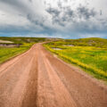 Storm clouds on Indian Creek Drive in the western region of Badlands National Park, near Scenic.