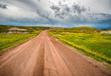 Storm clouds on Indian Creek Drive in the western region of Badlands National Park, near Scenic.