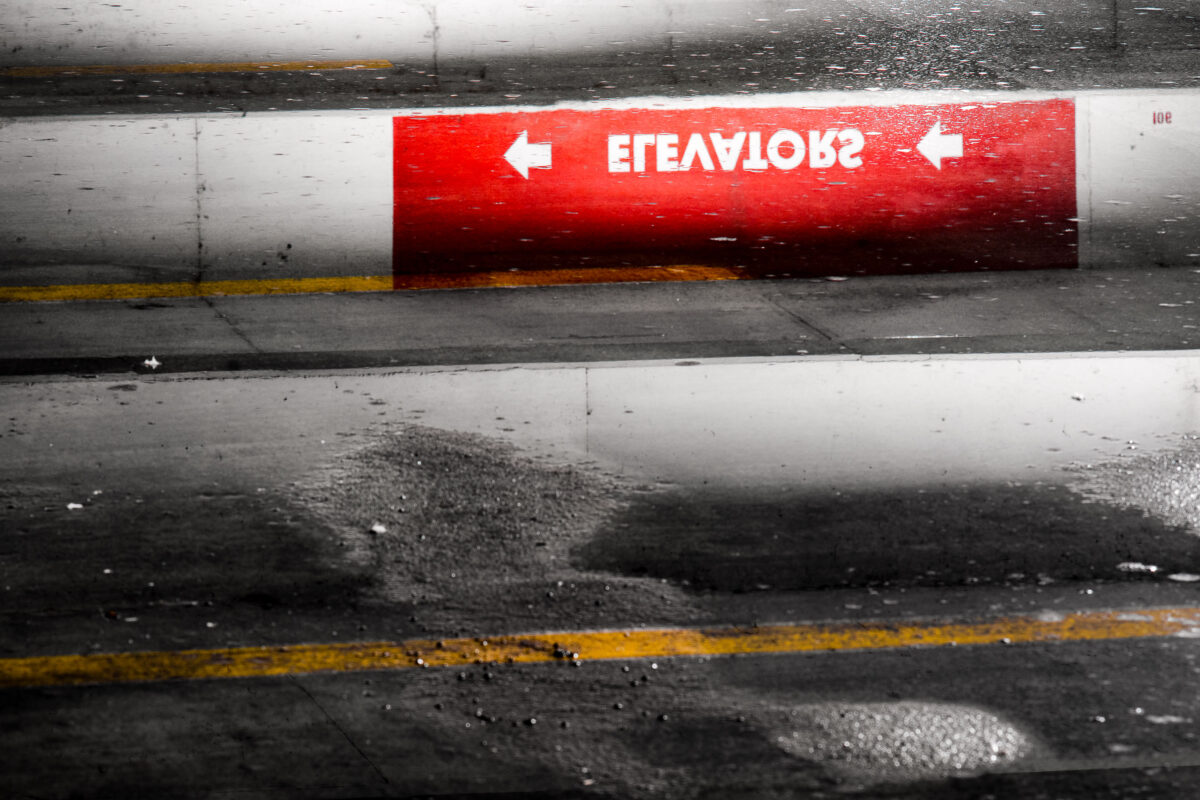 Elevators sign reflection