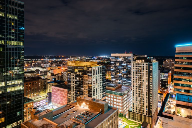 Nic on Fifth and Downtown Minneapolis Skyline at Night 1