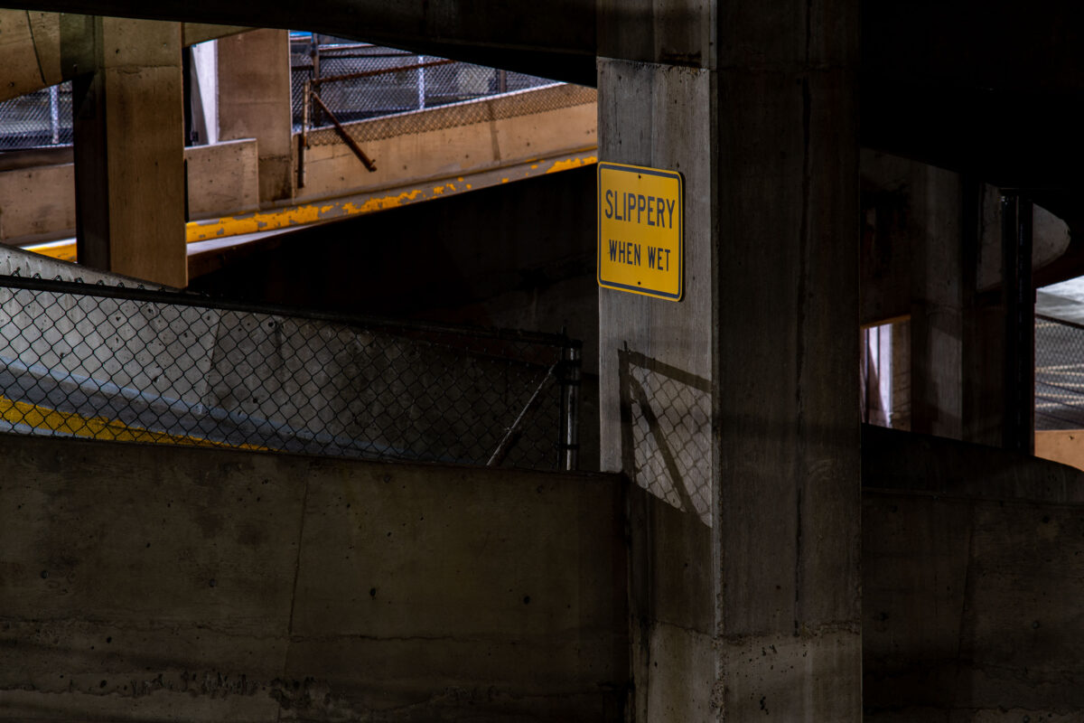 Slippery When Wet sign in Parking Ramp