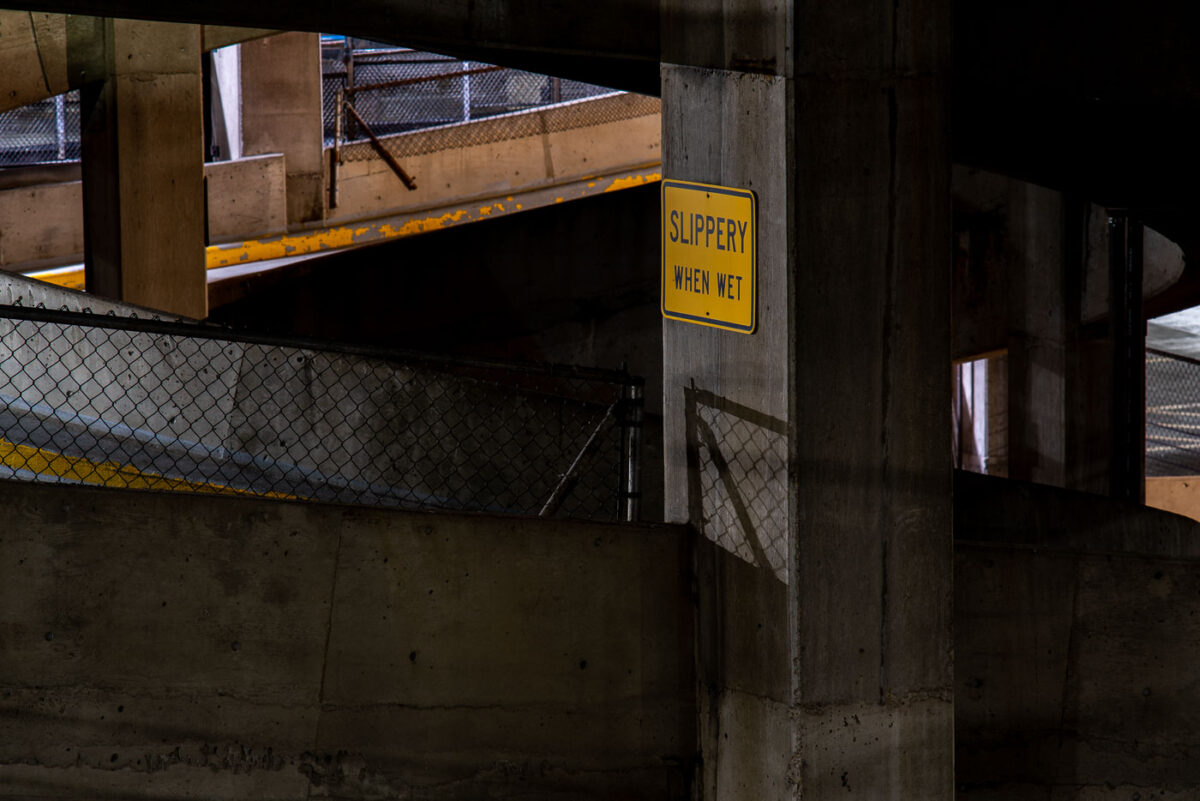 A "Slippery When Wet" sign in a downtown Minneapolis parking garage.
