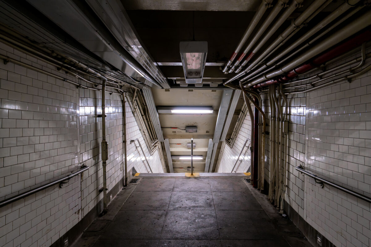 NYC Subway Stairwell with Exposed Piping