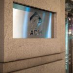 The Archer Daniels Midland (ADM) headquarters in downtown Chicago, Illinois, represents the global reach of one of the world’s largest agricultural and food processing corporations. Founded in 1902, ADM moved its main offices to Chicago in 2014 after more than a century in Decatur, Illinois. The company plays a major role in grain trading, oilseed processing, and biofuels, influencing commodity markets and global food supply chains. Its Chicago location, near the Chicago River and the city’s historic financial district, reflects the enduring link between Midwest agriculture and the global commodities trade that has long defined Chicago’s economic identity.