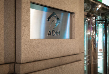 The Archer Daniels Midland (ADM) headquarters in downtown Chicago, Illinois, represents the global reach of one of the world’s largest agricultural and food processing corporations. Founded in 1902, ADM moved its main offices to Chicago in 2014 after more than a century in Decatur, Illinois. The company plays a major role in grain trading, oilseed processing, and biofuels, influencing commodity markets and global food supply chains. Its Chicago location, near the Chicago River and the city’s historic financial district, reflects the enduring link between Midwest agriculture and the global commodities trade that has long defined Chicago’s economic identity.