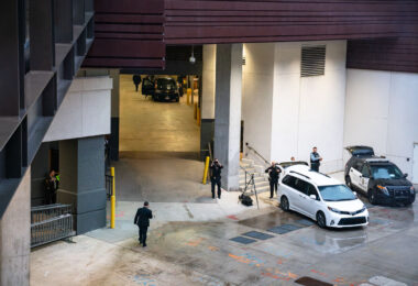 Secret Service looking through binoculars outside the Target Center in Minneapolis on October 10, 2019. He awaits the Presidential motorcade.