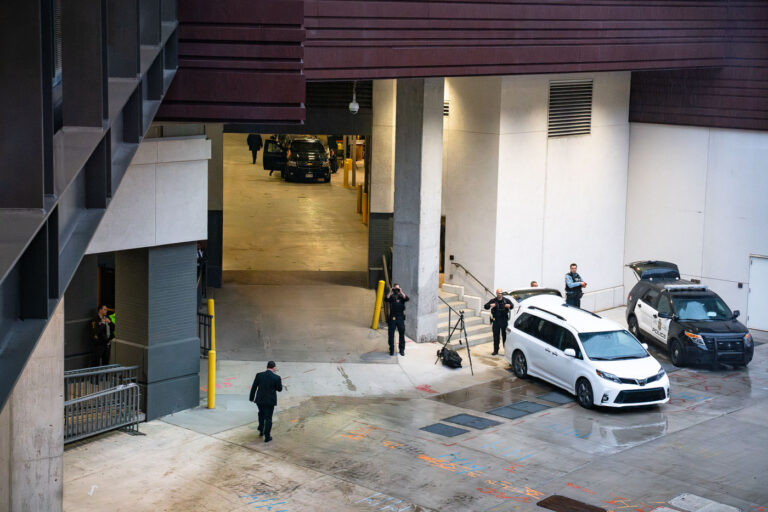 Secret Service awaiting President Trump in Minneapolis 4 Secret Service looking through binoculars outside the Target Center in Minneapolis on October 10, 2019. He awaits the Presidential motorcade.