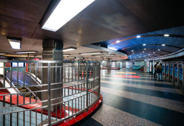 Passengers purchase tickets inside the Grand/State train station in Chicago.