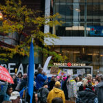 Protesters outside the Target Center in downtown Minneapolis. Trump supporters behind the glass. Campaign event October 10, 2019