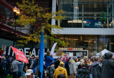 Protesters outside the Target Center in downtown Minneapolis. Trump supporters behind the glass. Campaign event October 10, 2019