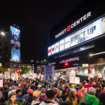 Protesters hold up signs outside the Target Center in downtown Minneapolis. The site of a Trump campaign rally on October 10, 2019.