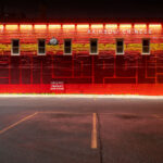 Rainbow Chinese Mural on Eat Street, Minneapolis 3 The bright red mural on the side of Rainbow Chinese Restaurant at 2739 Nicollet Avenue anchors Minneapolis’s iconic “Eat Street” corridor. Painted in bold geometric letters spelling “Minneapolis,” the work was designed to celebrate the neighborhood’s cultural diversity and long history as a hub for immigrant-owned restaurants. The panda motif and stylized lettering nod to the restaurant’s founder, Tammy Wong, whose establishment has been a local fixture since 1987. The mural, illuminated at night by warm overhead lighting, has become a recognizable landmark symbolizing the creative and culinary energy of Eat Street in the Whittier neighborhood.