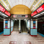 Randolph/Washington station sits beneath the heart of downtown Chicago, forming part of the CTA Red Line that runs through the State Street subway. Opened in 1943 as part of the city’s ambitious subway expansion, the station connects directly to the extensive Chicago Pedway system, linking offices, retail centers, and civic buildings underground. Its tiled vault and distinctive 1940s-era design remain largely intact, representing the Art Moderne phase of Chicago’s transit infrastructure.