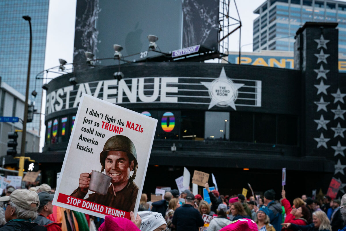 Sign reading "I didn't fight the nazi's just so Trump could turn America fascist" being held up outside First Avenue during a Trump protest in Minneapolis on October 10, 2019.