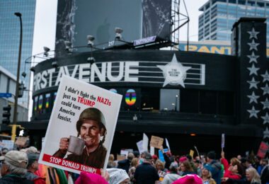 Sign reading "I didn't fight the nazi's just so Trump could turn America fascist" being held up outside First Avenue during a Trump protest in Minneapolis on October 10, 2019.