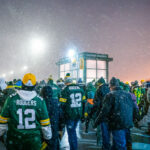 Fans wearing Aaron Rodgers jerseys leave Lambeau Field after the Packers beat the Carolina Panthers 24-16.