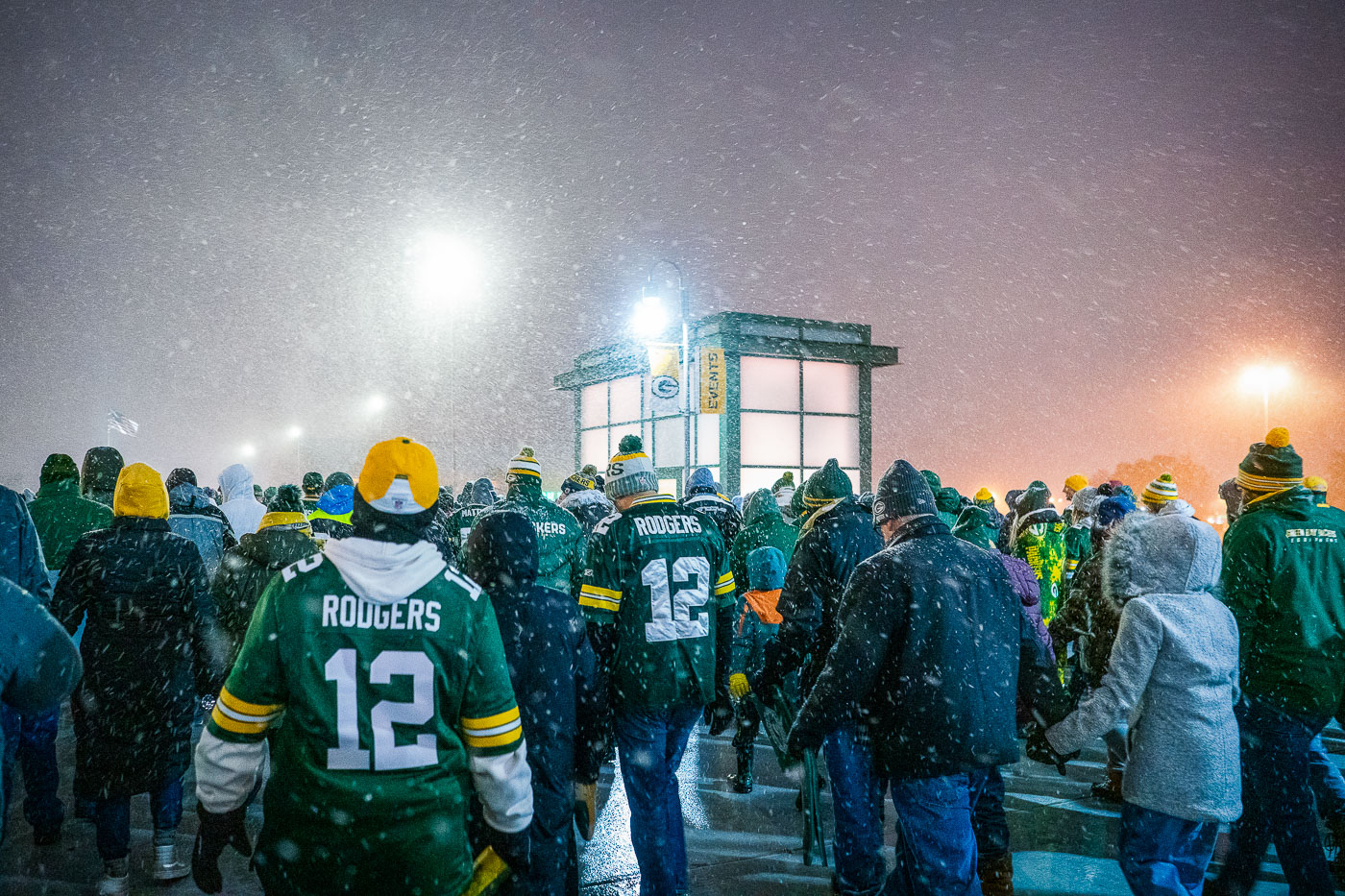 Fans wearing Aaron Rodgers jerseys leave Lambeau Field after the Packers beat the Carolina Panthers 24-16.