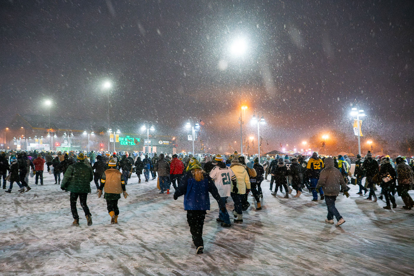 Fans leave Lambeau Field on a snowy evening at Lambeau Field in Green Bay, WI. The Packers defeated the Carolina Panthers 24-16.