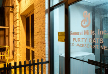 Once part of the vast milling network that shaped Minneapolis’s industrial identity, this now-closed General Mills Purity Oats plant at 1201 Jackson Street NE reflects the city’s transition from global grain hub to post-industrial reuse. The modest brick complex, still bearing its original signage, served as a specialized processing site within the company’s broader cereal operations before its eventual closure. Its preservation offers a glimpse into the city’s enduring ties to the flour and oat industries that once defined the Mississippi River corridor.