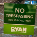Sign that reads: No Trespassing. Prohibido EL Paso. Ryan.