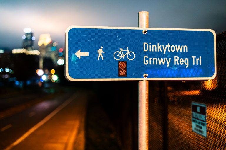 Trail sign for Dinkytown Greenway on West River Parkway